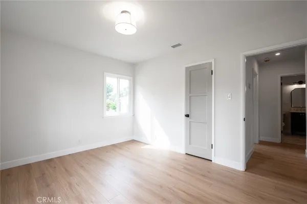 a living room with furniture potted plant and a window