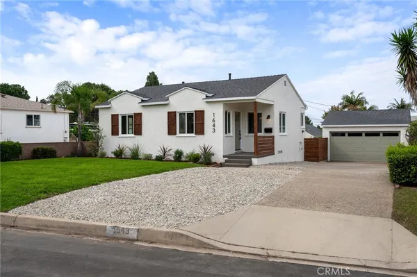 front view of a house with a yard