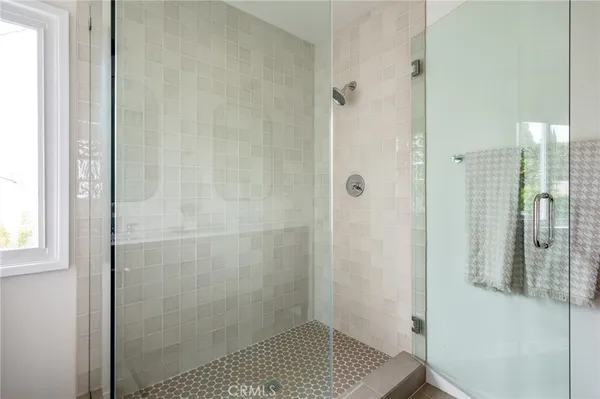 a view of a backyard with plants and a patio