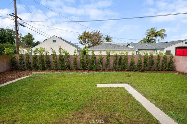an aerial view of a house with a swimming pool yard and outdoor seating