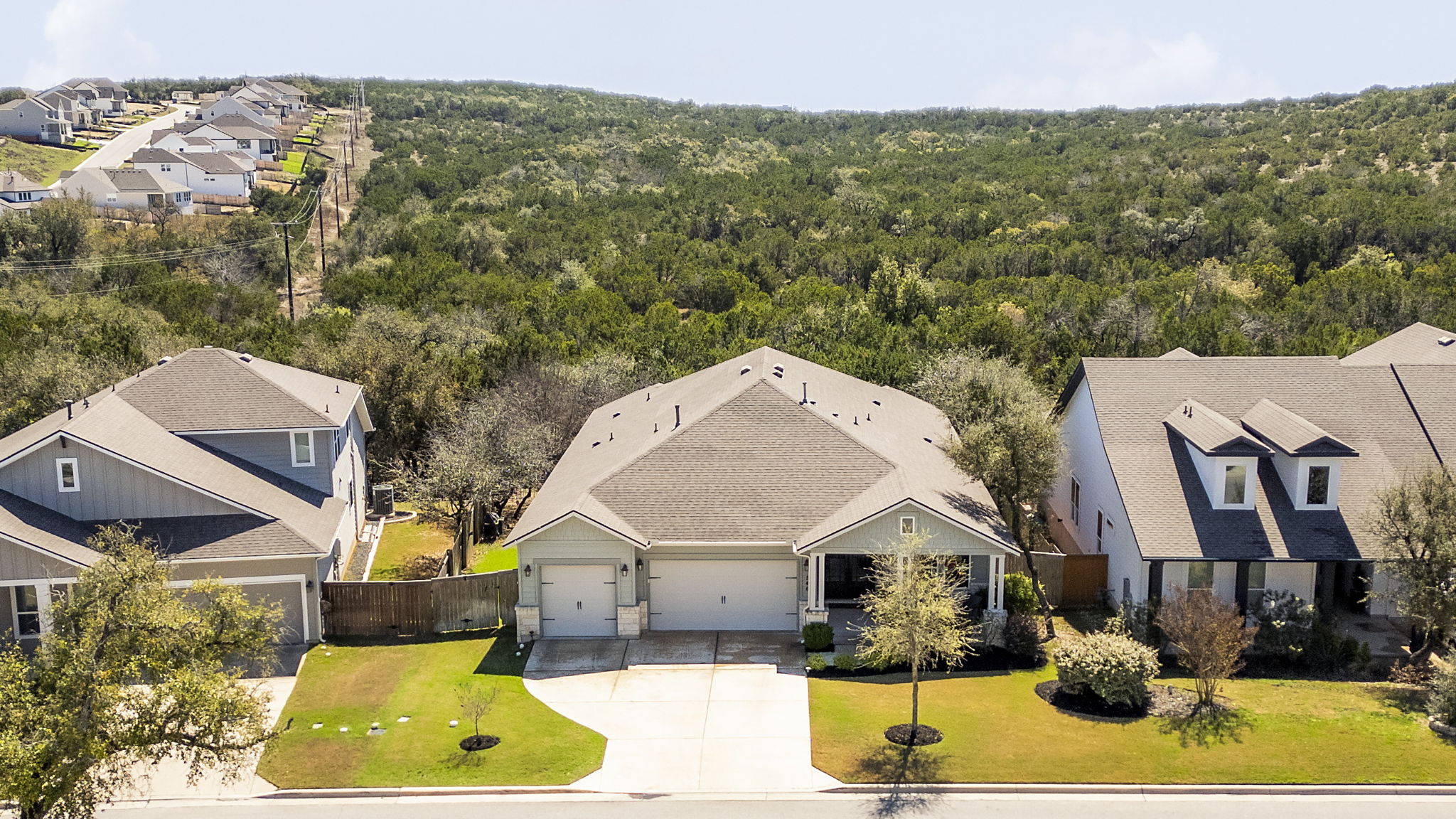 546 Hazy Hills Loop Dripping Springs, TX 78620 - Photo 1 of 40 Situated on a large greenbelt lot in the sought-after Headwaters community, this beautifully maintained single-story home offers timeless curb appeal and a welcoming presence.