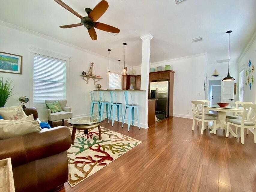 1916 Staples Avenue Key West, FL 33040 - Photo 9 of 18 a living room with furniture a wooden floor and a window