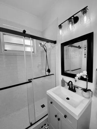 a bathroom with a sink and a mirror