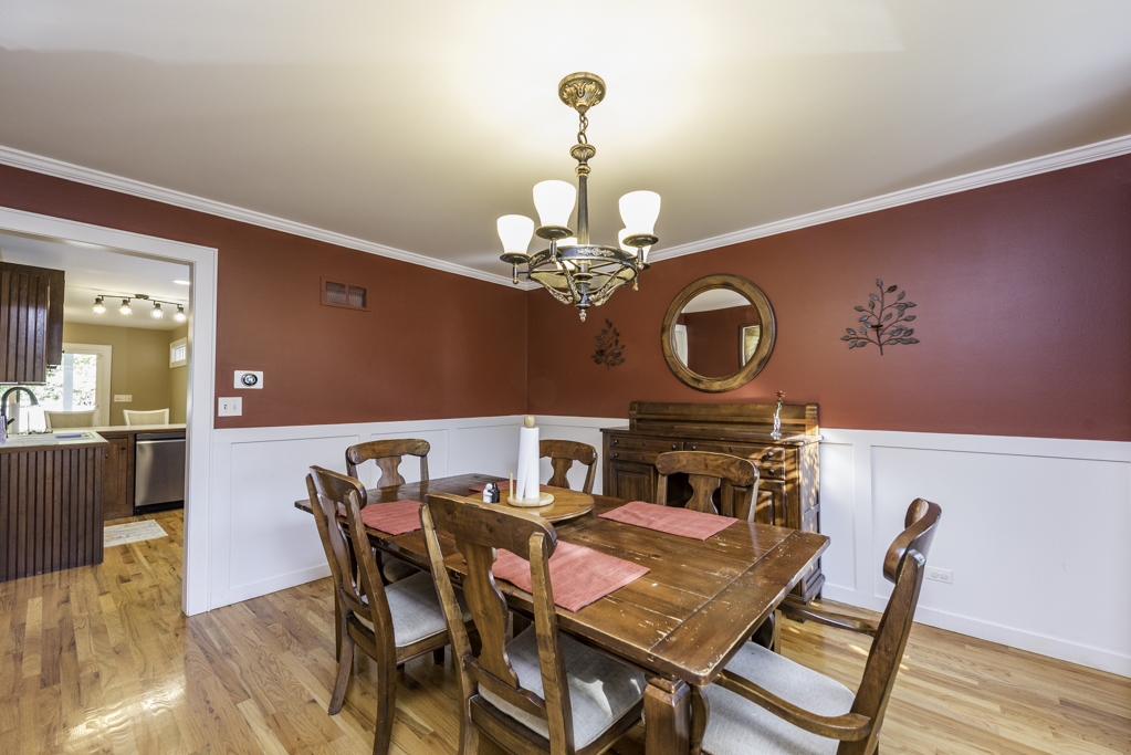3482 Ellis Avenue Gurnee, IL 60031 - Photo 12 of 46 a view of a dining room with furniture and chandelier