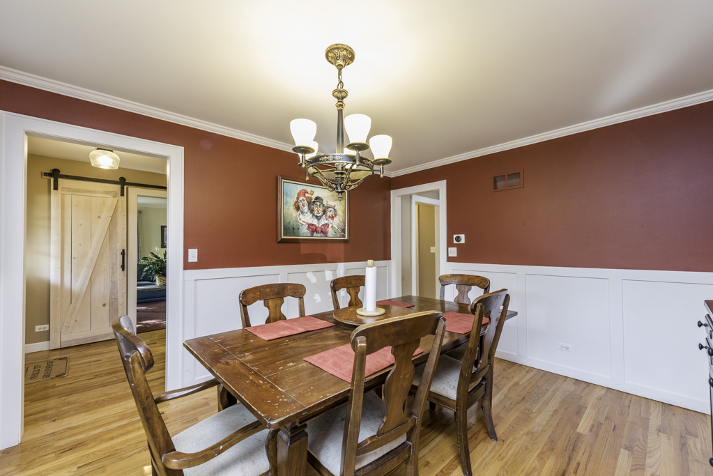 3482 Ellis Avenue Gurnee, IL 60031 - Photo 13 of 46 a view of a dining room with furniture and chandelier