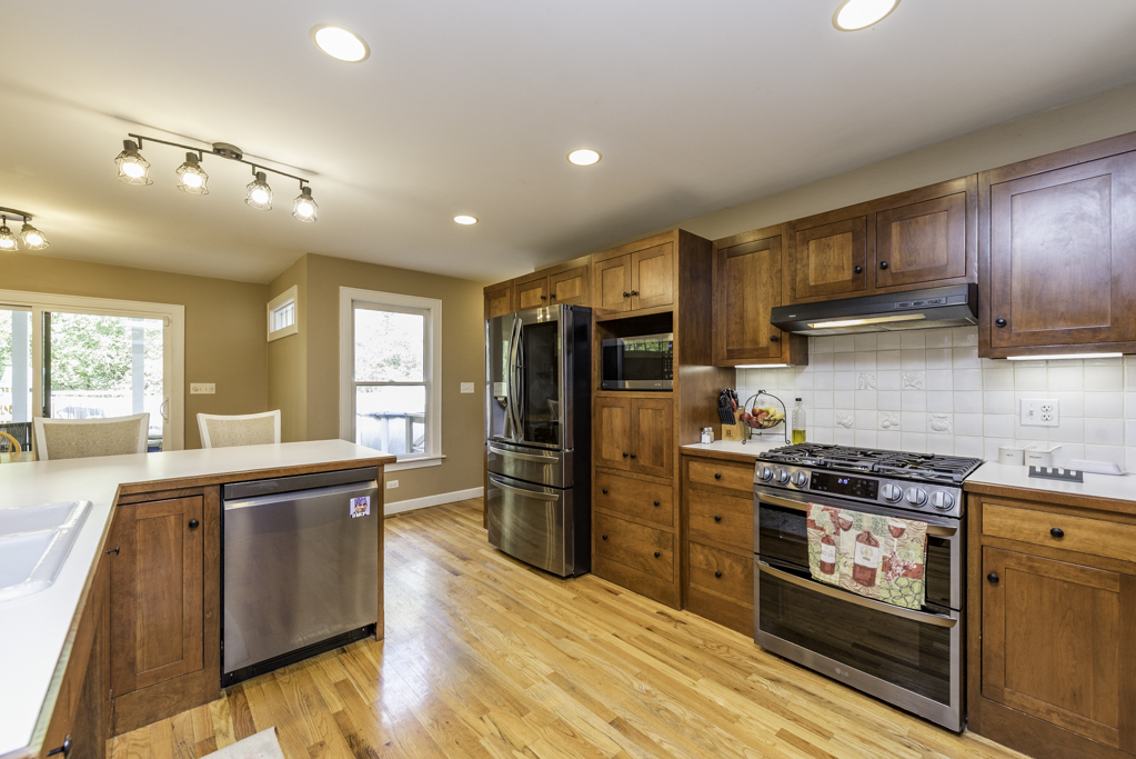 3482 Ellis Avenue Gurnee, IL 60031 - Photo 16 of 46 a kitchen with stainless steel appliances granite countertop a stove refrigerator and cabinets