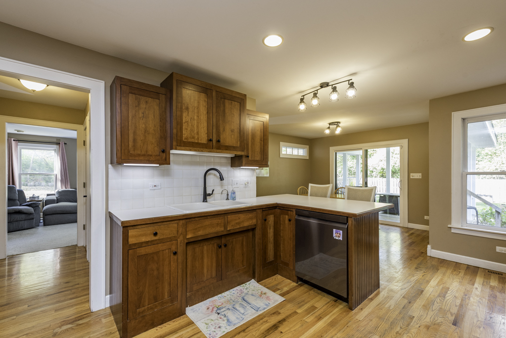 3482 Ellis Avenue Gurnee, IL 60031 - Photo 17 of 46 a kitchen with a sink and wooden cabinets