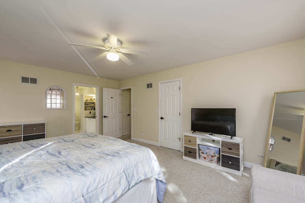 3482 Ellis Avenue Gurnee, IL 60031 - Photo 25 of 46 a bedroom with a bed and a flat screen tv