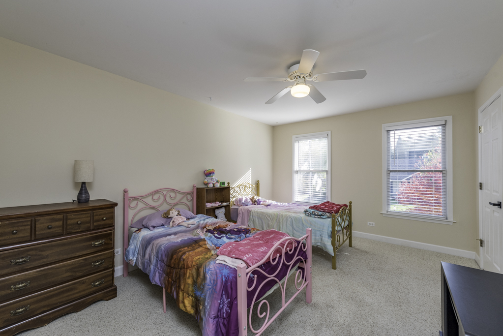 3482 Ellis Avenue Gurnee, IL 60031 - Photo 28 of 46 a bedroom with bed and window