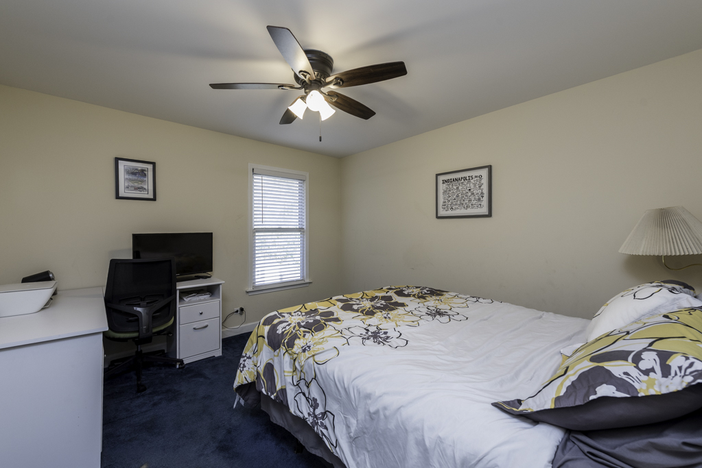 3482 Ellis Avenue Gurnee, IL 60031 - Photo 29 of 46 a bedroom with a bed and a chandelier