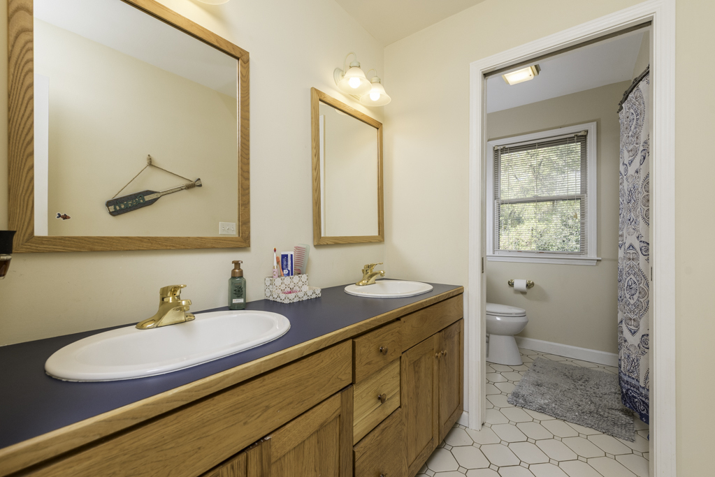 3482 Ellis Avenue Gurnee, IL 60031 - Photo 32 of 46 a bathroom with a granite countertop sink toilet and a mirror