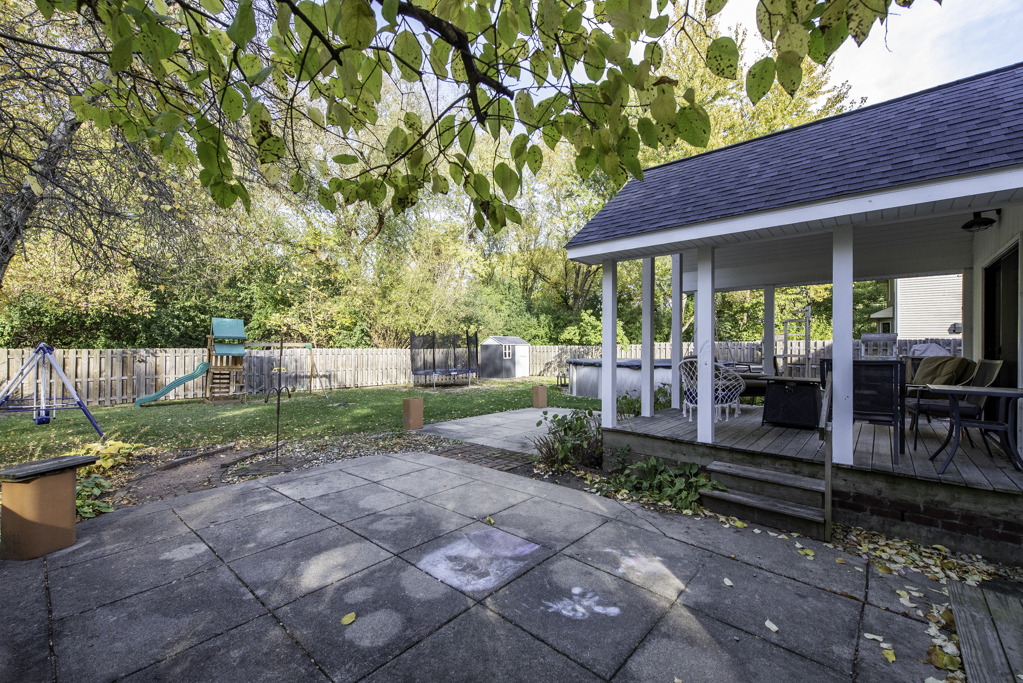 3482 Ellis Avenue Gurnee, IL 60031 - Photo 39 of 46 a view of a patio with table and chairs under an umbrella