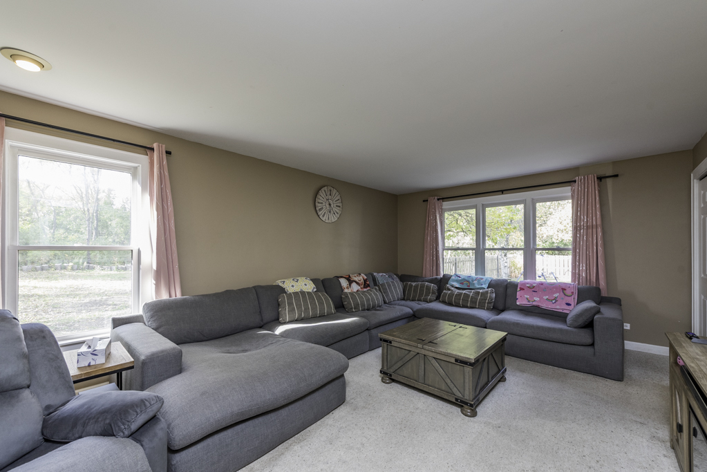 3482 Ellis Avenue Gurnee, IL 60031 - Photo 8 of 46 a living room with furniture and a large window