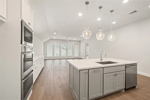 a bathroom with a double vanity sink mirror and double