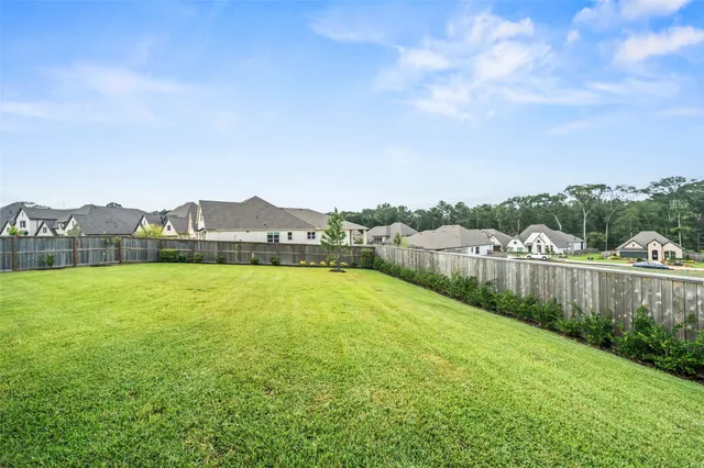 a view of a lake with houses in the back
