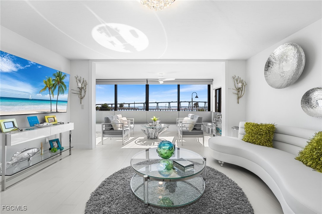 a living room with furniture a rug and a window