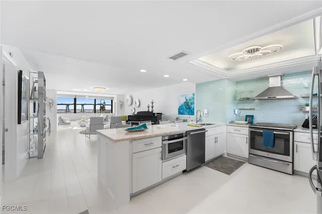 a kitchen with a stove top oven and cabinets