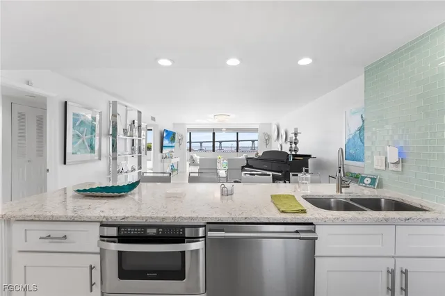 a kitchen with a stove and a white cabinets
