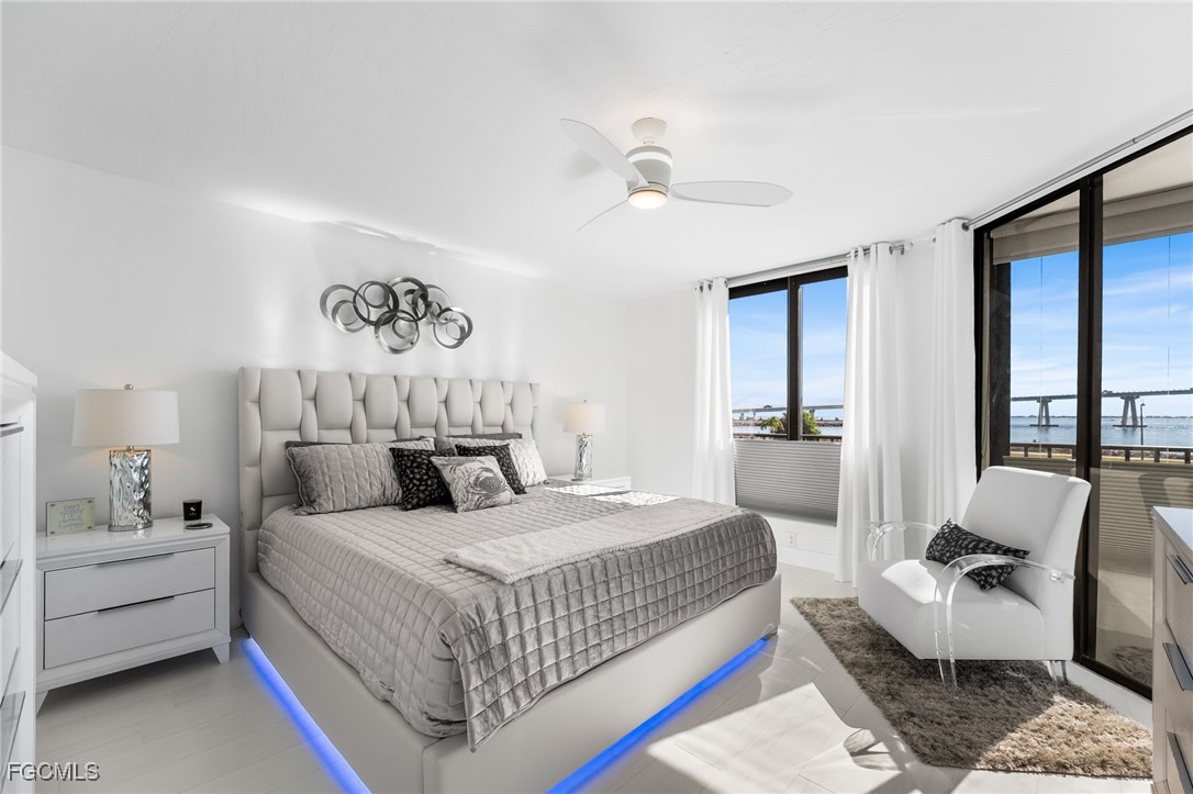 15010 Punta Rassa Road, Unit 106 Fort Myers, FL 33908 - Photo 16 of 36 a bedroom with a bed and a couch