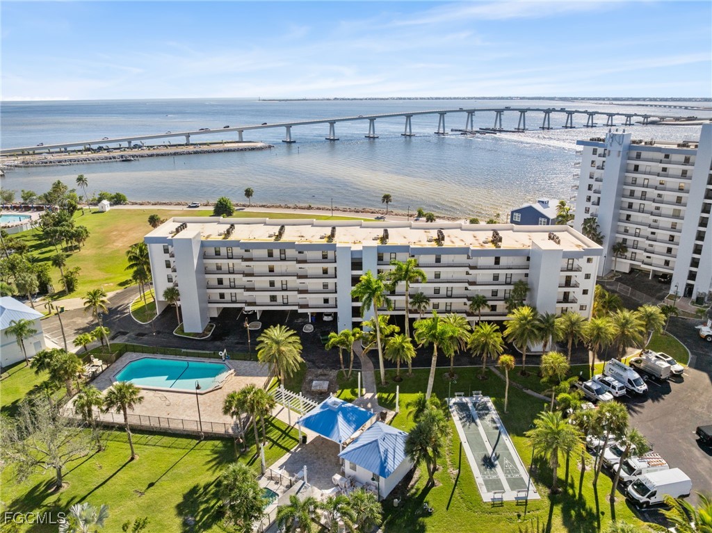 15010 Punta Rassa Road, Unit 106 Fort Myers, FL 33908 - Photo 2 of 36 a view of swimming pool with outdoor seating