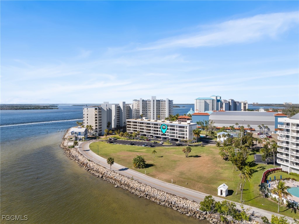 15010 Punta Rassa Road, Unit 106 Fort Myers, FL 33908 - Photo 31 of 36 a view of a swimming pool with an ocean view