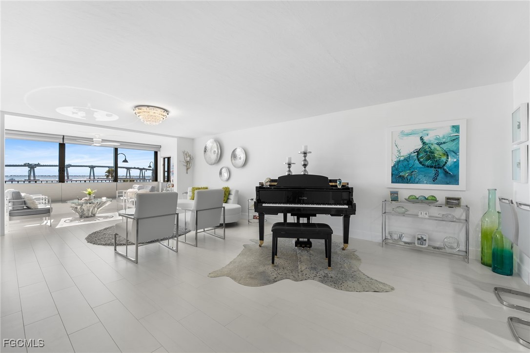 15010 Punta Rassa Road, Unit 106 Fort Myers, FL 33908 - Photo 7 of 36 a living room with furniture and a potted plant