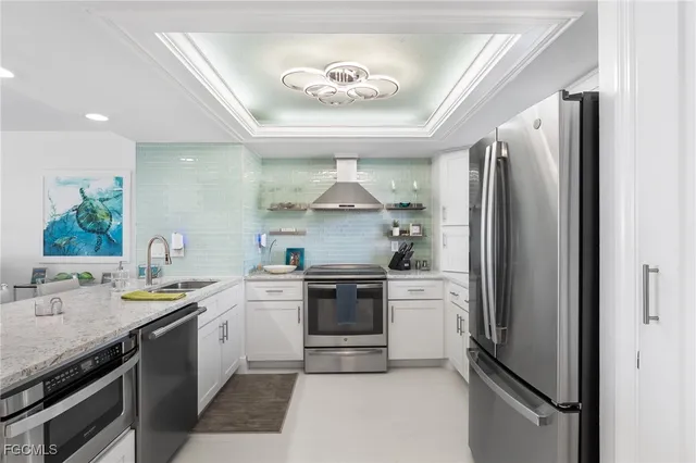 a kitchen with a stove and a refrigerator