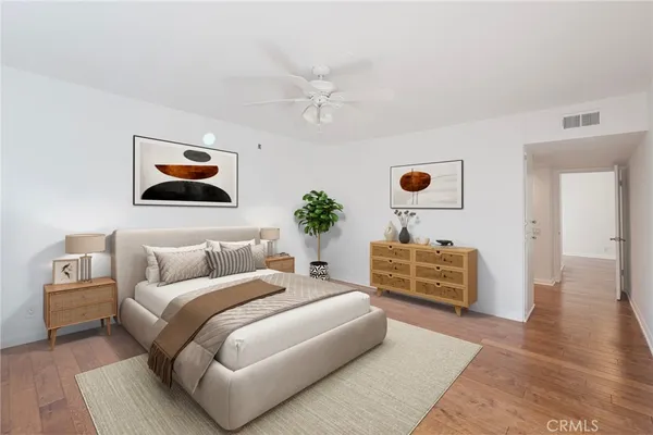 a bedroom with furniture and a chandelier
