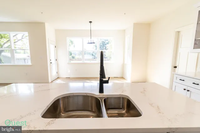 a bathroom with a sink a mirror and a toilet
