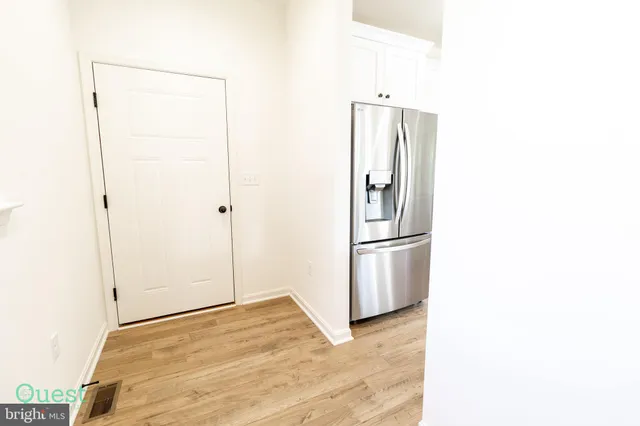 a bathroom with a shower and a glass door