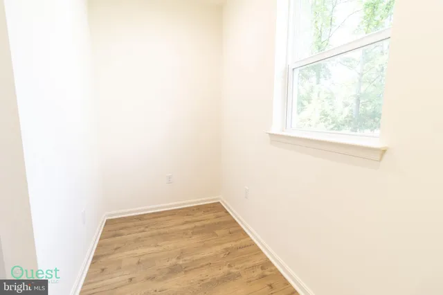 a bathroom with a double vanity sink and mirror