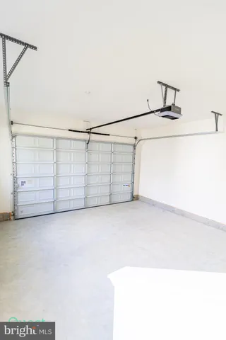 a white toilet sitting next to a white cabinet