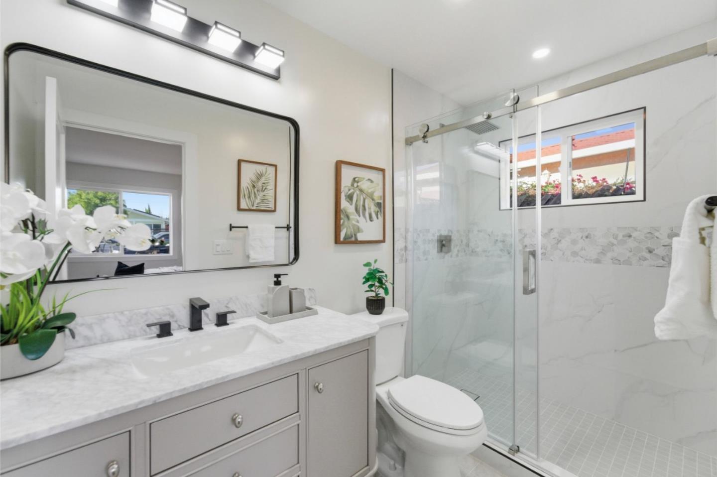 391 Gross Street Milpitas, CA 95035 - Photo 15 of 29 a bathroom with a sink a toilet and shower