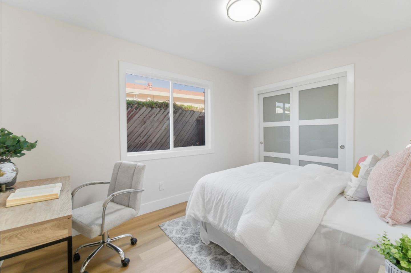 391 Gross Street Milpitas, CA 95035 - Photo 19 of 29 a bedroom with a bed and a chair