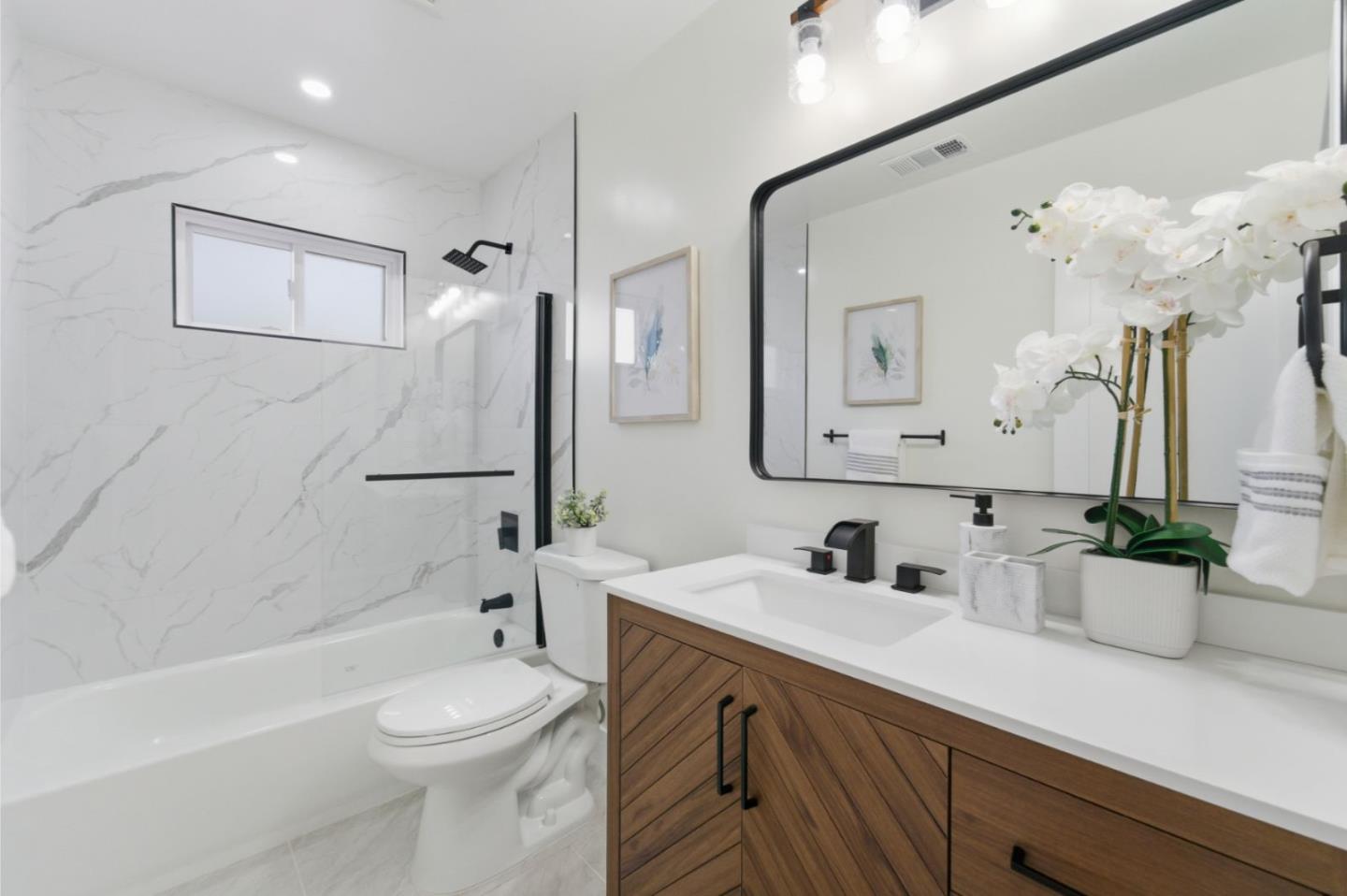 391 Gross Street Milpitas, CA 95035 - Photo 22 of 29 a bathroom with a sink a toilet and shower