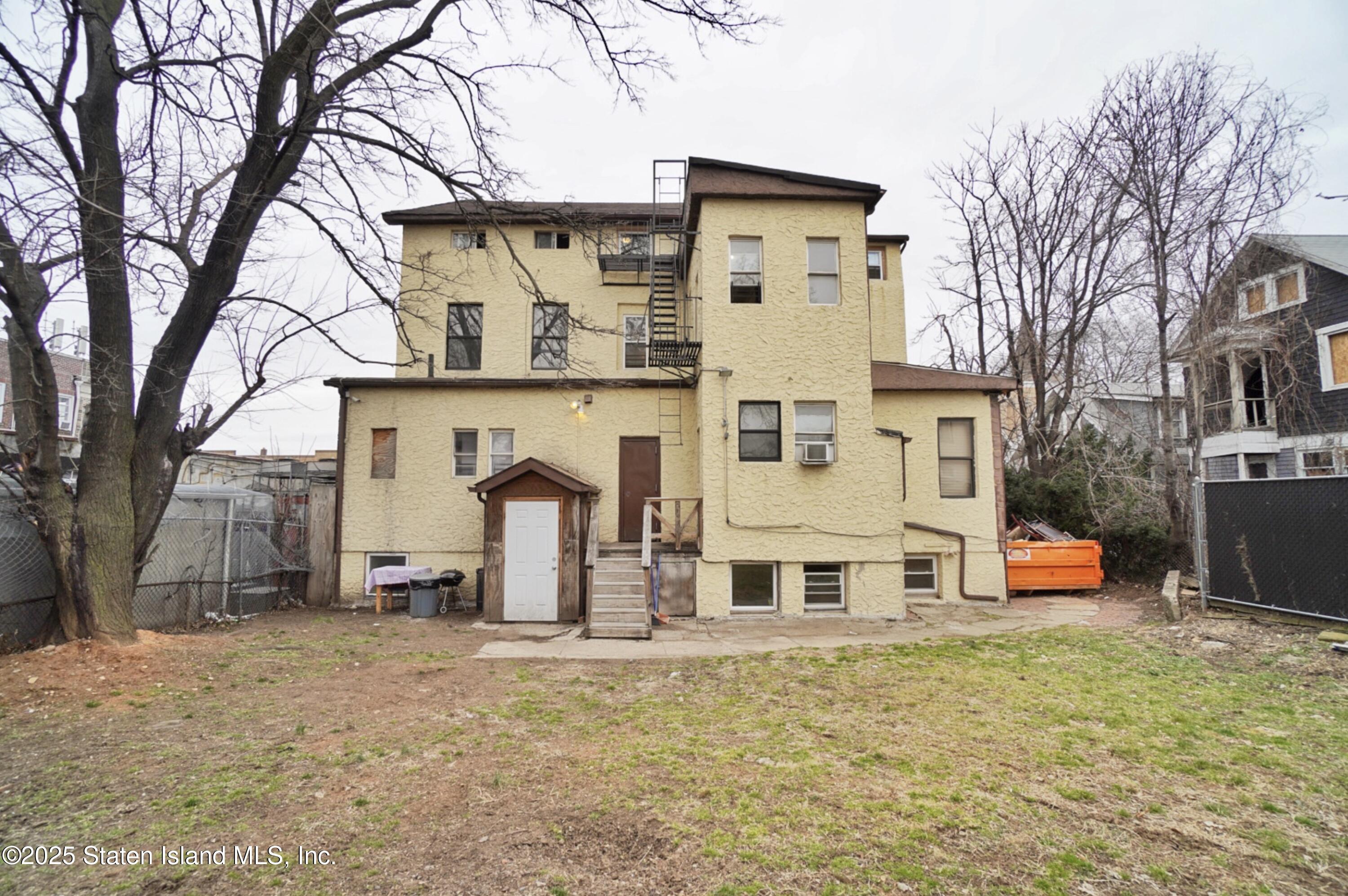 90 Vreeland Street Staten Island, NY 10302 - Photo 13 of 25 front view of a house with a large tree