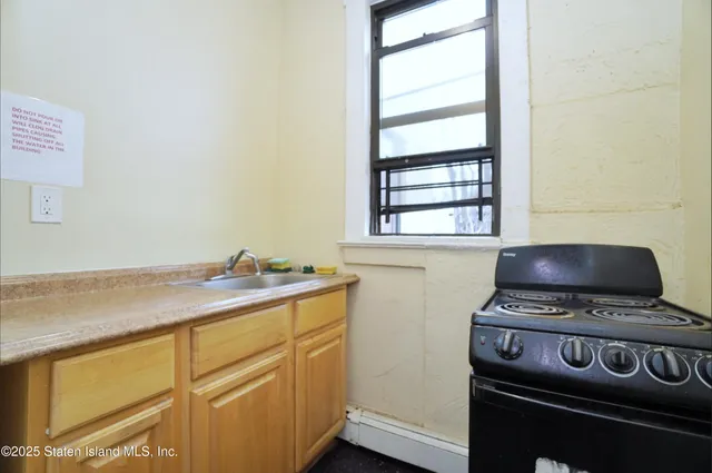 a view of storage and utility room with washer and dryer