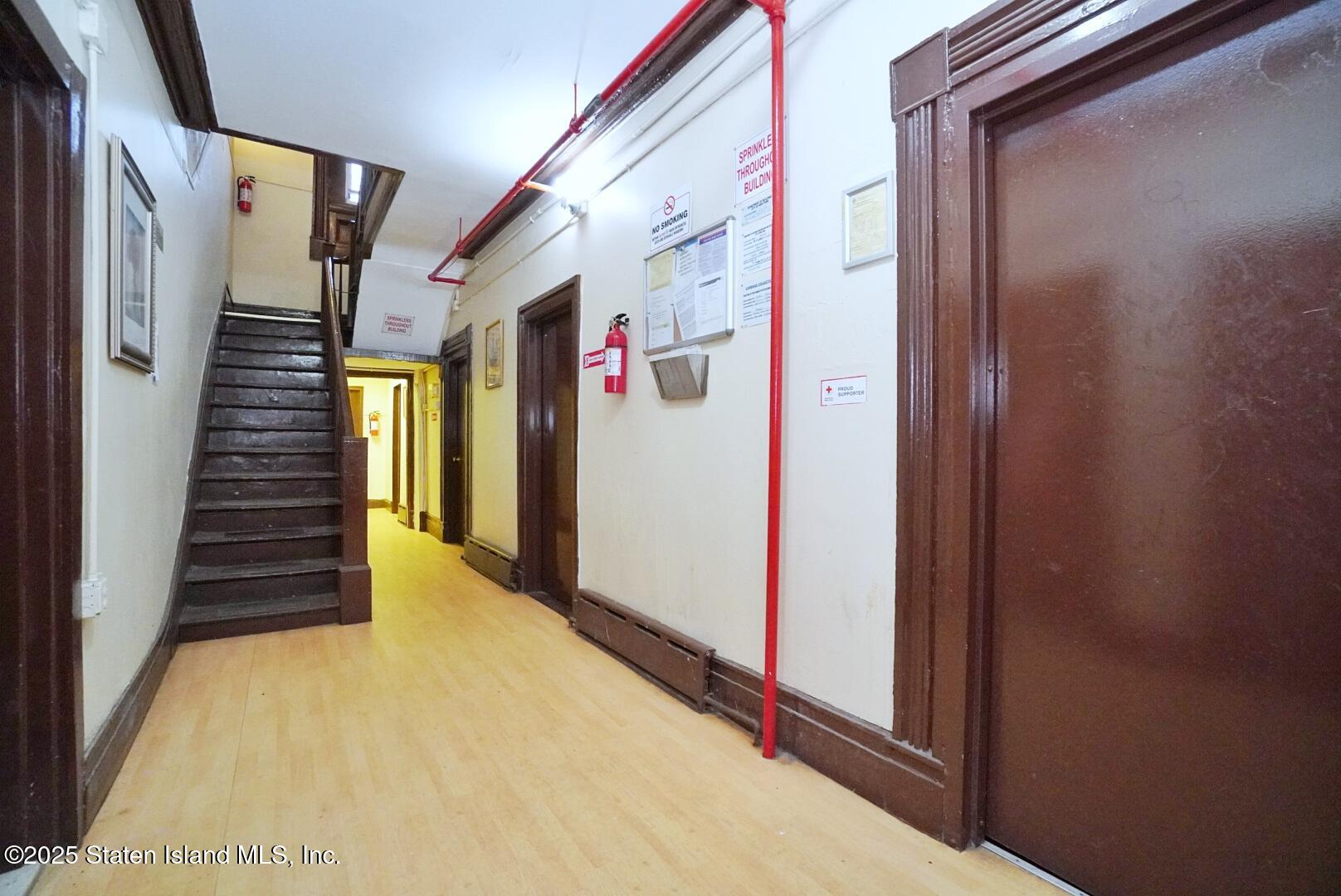 90 Vreeland Street Staten Island, NY 10302 - Photo 4 of 25 a view of a hallway with wooden floor and entryway