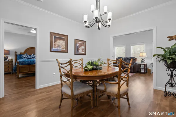 a view of a dining room with furniture and wooden floor