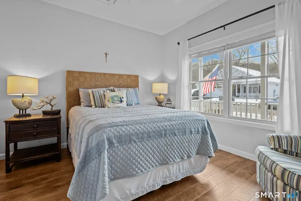 a bedroom with a large bed and a window