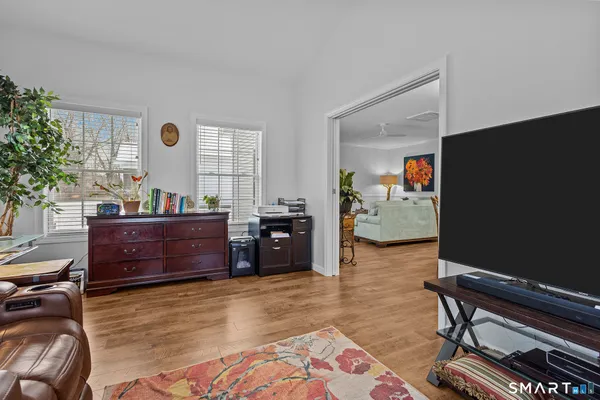 a room with furniture and a flat screen tv
