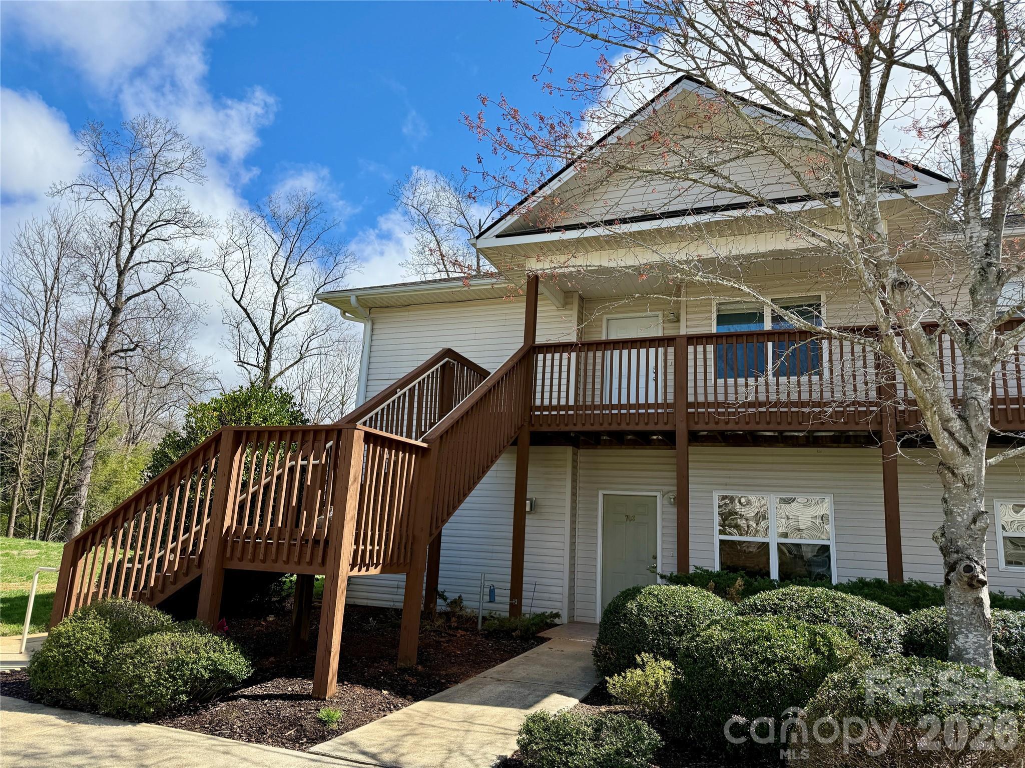 703 Olde Covington Way Arden, NC 28704 - Photo 1 of 23 a front view of a house with garden