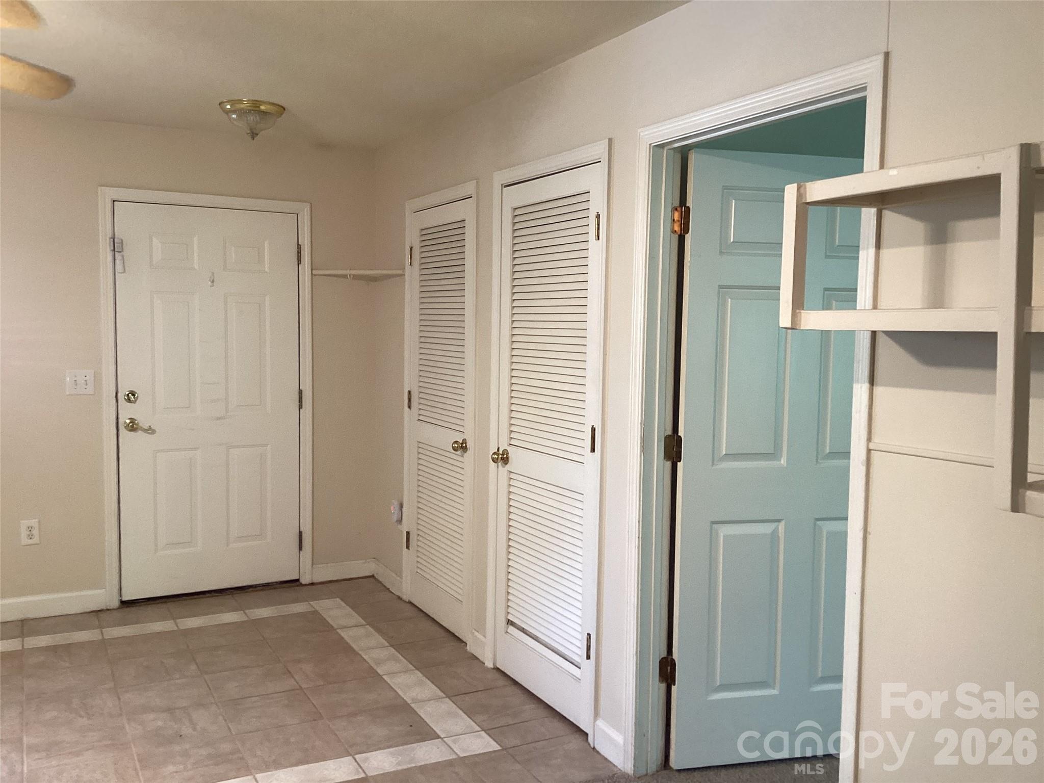 703 Olde Covington Way Arden, NC 28704 - Photo 14 of 23 a view of an empty room with a door