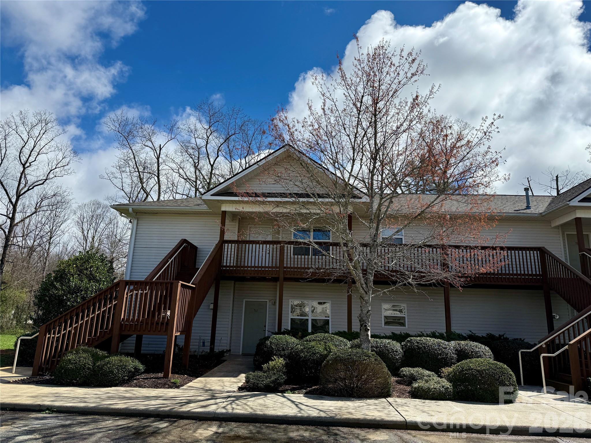 703 Olde Covington Way Arden, NC 28704 - Photo 2 of 23 a front view of a house with garden