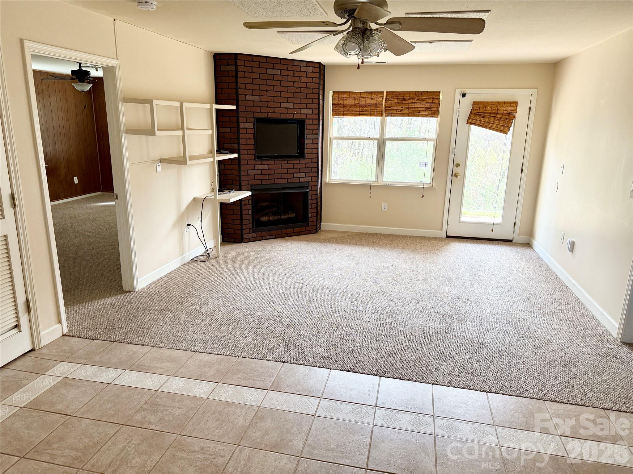 703 Olde Covington Way Arden, NC 28704 - Photo 6 of 23 a view of a livingroom with a fireplace