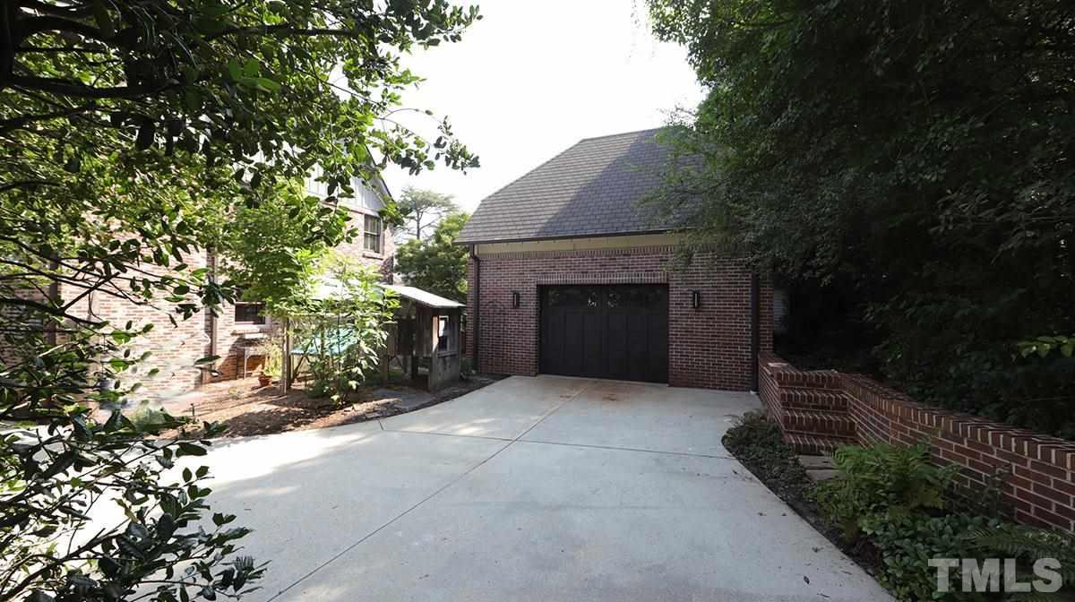 2308 Byrd Street Raleigh, NC 27608 - Photo 3 of 30 A rare find in this area- a detached brick 2 car garage with side door and walkway to the home in addition to access from the front driveway AND rear driveway out to Breeze Rd.