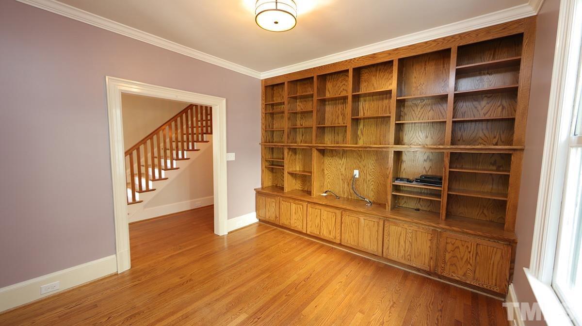 2308 Byrd Street Raleigh, NC 27608 - Photo 8 of 30 An intimate spot to relax with great built in bookshelves and sound system found in most rooms (white knobs on light switch). You could remove middle shelves if wanted to add flat screen TV.