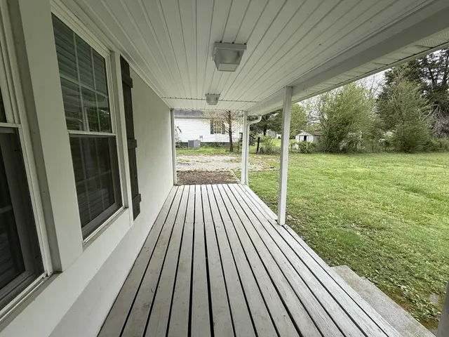 a view of backyard with green space