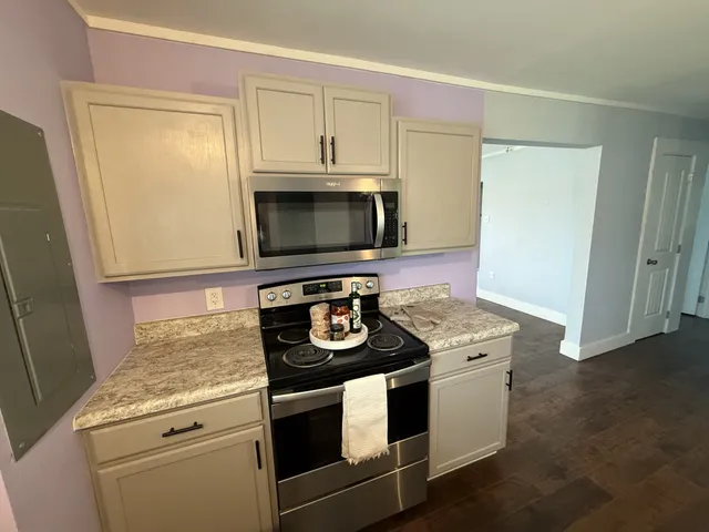 a kitchen with a stove and a microwave