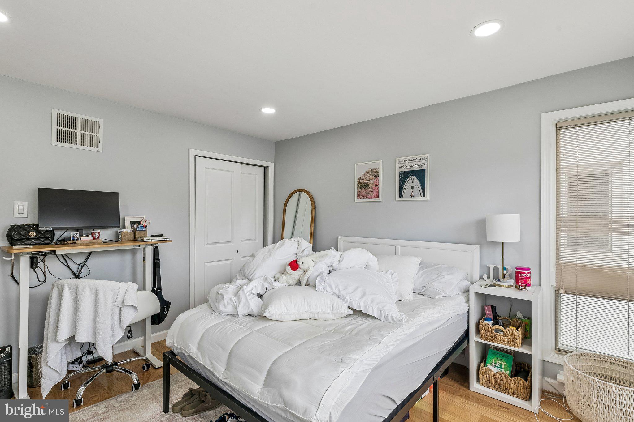 1130 Lombard Street Philadelphia, PA 19147 - Photo 24 of 45 a bedroom with a bed and a flat screen tv